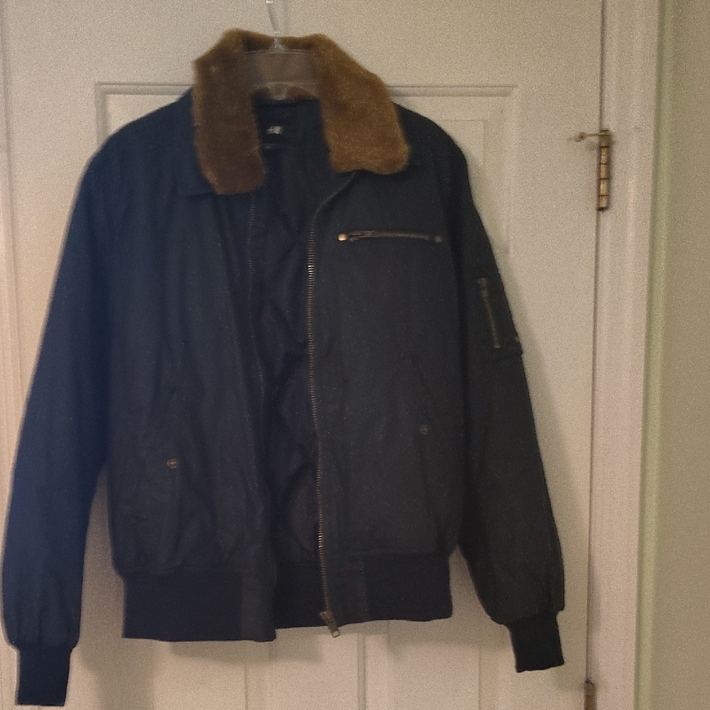 Black Jacket with Brown Fur Collar.